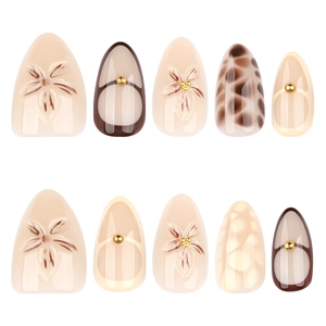 3D floral and leopard print almond press-on nails with gold studs on nude base
