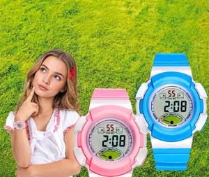 Waterproof kids electronic watch showing pink and blue models on green grass background