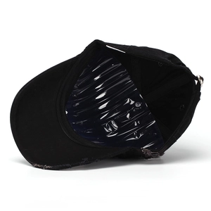 Distressed vintage black denim baseball cap with frayed brim and adjustable metal buckle
