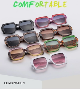 Multiple pairs of stylish oversized square sunglasses in assorted colors and patterns