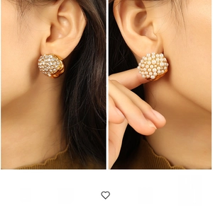 Detailed comparison of luxury gold stud earrings with sparkling crystals and white pearls