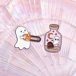 Halloween ghost pins set featuring a ghost with chainsaw and RIP gravestone bottle