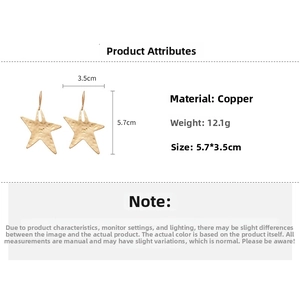 Macro detail of gold crinkled star earrings showing size 5.7x3.5cm and copper material
