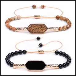 Detail view of adjustable beaded bracelets with natural stones and hexagonal metal charms