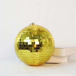 Golden disco mirror ball ornament with reflective glass facets for festive party decor