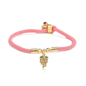 Pink braided rope bracelet with gold grape pendant featuring purple and green zircon