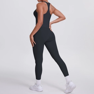 Close-up of black racerback yoga set featuring high-waist leggings with side pockets