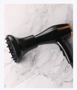 Close-up of professional hair dryer with large diffuser nozzle for curly hair styling