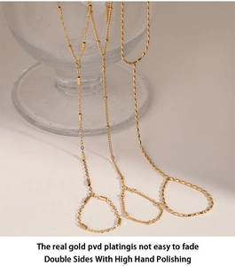 Detail of PVD gold plated stainless steel chains showing three distinct link textures