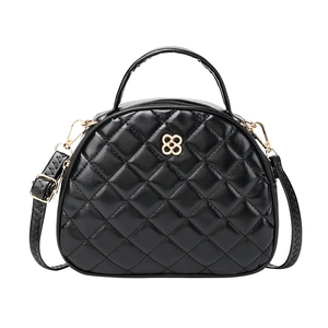 Fashionable black quilted half-round crossbody bag with gold floral metal accent