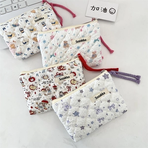 Quilted floral pouches with woven rope zipper pulls in four cute cartoon patterns