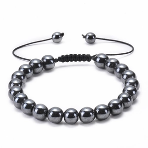 Close-up of adjustable hand-woven bracelet with hematite beads and sliding knot detail