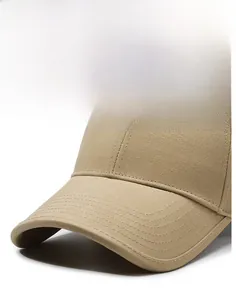 Detail of khaki twill baseball cap brim showing reinforced stitching and stiff texture