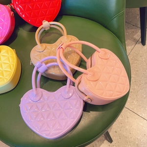 Close-up of colorful heart-shaped PVC jelly bags featuring quilted texture and glossy finish