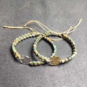 Handcrafted dual-layer African turquoise beaded bracelet with tree of life metal charm