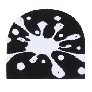 Detail of classic black knit beanie featuring white splash pattern and fine knitting