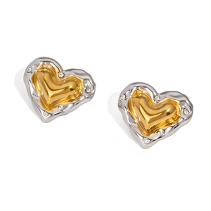 Close-up of heart-shaped two-tone stud earrings featuring clear crystal embellishments