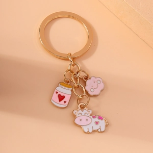 Cartoon cow and cloud keychain with pink heart enamel pendants on golden metal ring