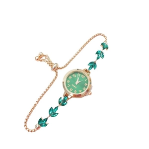 Elegant gold chain bracelet watch with green leaf-shaped gems and green quartz dial