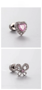 Detailed macro view of heart and bow screw back studs with pink cubic zirconia stones
