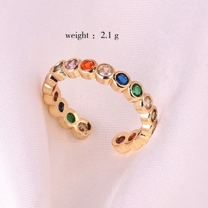 Detail view of gold rainbow zircon ring showing stone setting and 2.1g weight parameter