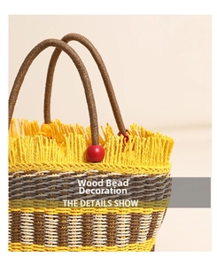 Detail of hand-woven bucket bag with colorful wood beads and straw tassel trim