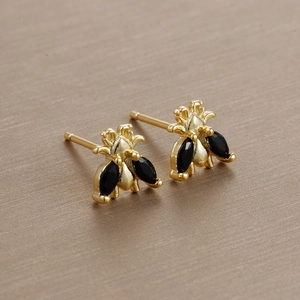 Detail of bee stud earrings with black marquise stones and gold plating for women