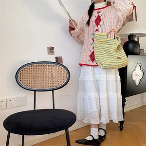 Stylish vintage striped fuzzy shoulder bag styled with a retro student autumn outfit