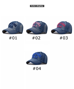 Detail display of four washed denim baseball caps with bold New York U.S.A. embroidery