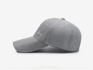 Detailed side view of grey mesh sports cap featuring white SPORT embroidery and long visor
