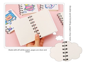 Detail of A7 cartoon astronaut notebook showing durable double spiral binding and beige pages