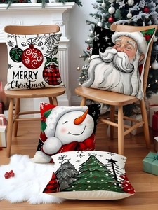 Détail de housses de coussin de Noël en lin avec motifs Père Noël et bonhomme de neige