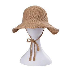 Handcrafted khaki straw sun hat with adjustable chin strap for outdoor sun protection