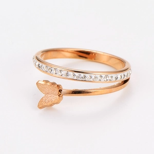 Detail of rose gold butterfly ring featuring matte wings and pavé zircon crystals