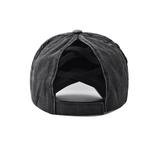 Detail of washed cotton ponytail baseball cap featuring three black elastic crisscross bands