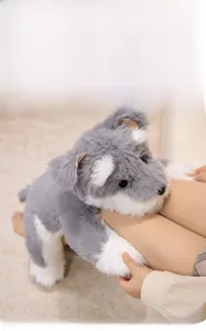 Close-up of soft grey and white plush schnauzer dog toy showing fluffy fabric texture