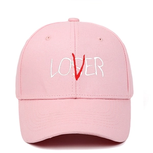 Detailed view of pink cotton canvas baseball cap with white and red LOVER embroidery