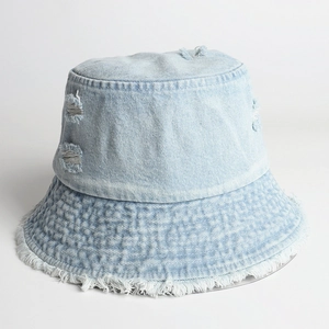 Distressed light blue denim bucket hat with frayed edges and retro ripped design details
