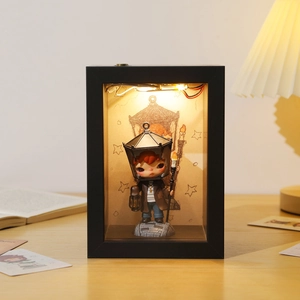Black hollow display frame box with warm LED lighting and miniature figurine design