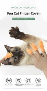 Macro shot of realistic silicone finger puppets interacting and massaging a cat