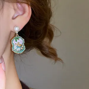 French vintage pearl drop earrings with green enamel bird charms and silver needles