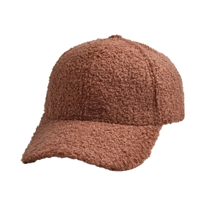 Close-up of caramel brown teddy fleece baseball cap showing thick warm texture