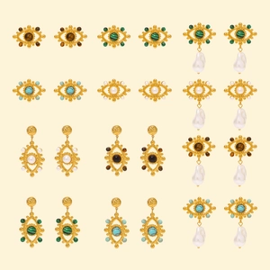 Vintage gold titanium steel earrings set featuring tiger eye stones and pearls with evil eye