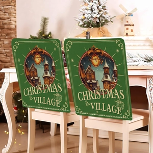Detail of green Christmas Village chair covers with vintage prints in a cozy home setting