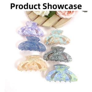 Variety set of six marble texture acrylic hair claws in assorted vintage colors on display