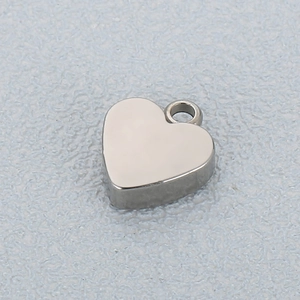 Polished stainless steel heart pendant with silver finish and bail for DIY jewelry