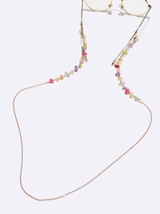Detail of colorful natural stones on golden eyeglass chain with anti-slip rubber loops