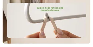 Detail of built-in hook on white clothing hanger for camisoles and underwear
