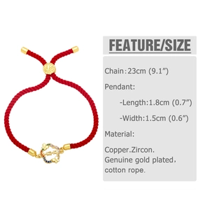 Detailed view of MAMA heart charm with colorful zircons on a red braided rope bracelet