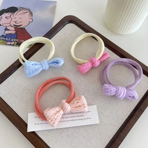 Set of 4 high-elasticity hair ties with corduroy bows in assorted pastel colors for girls